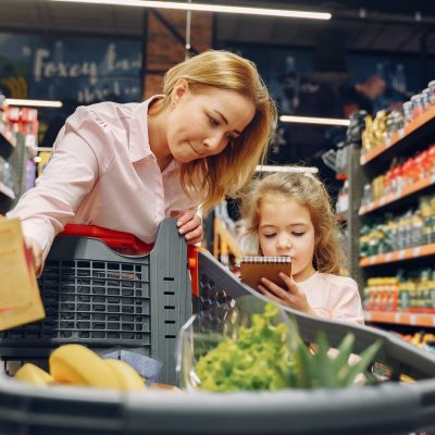 The family buys groceries at the supermarket